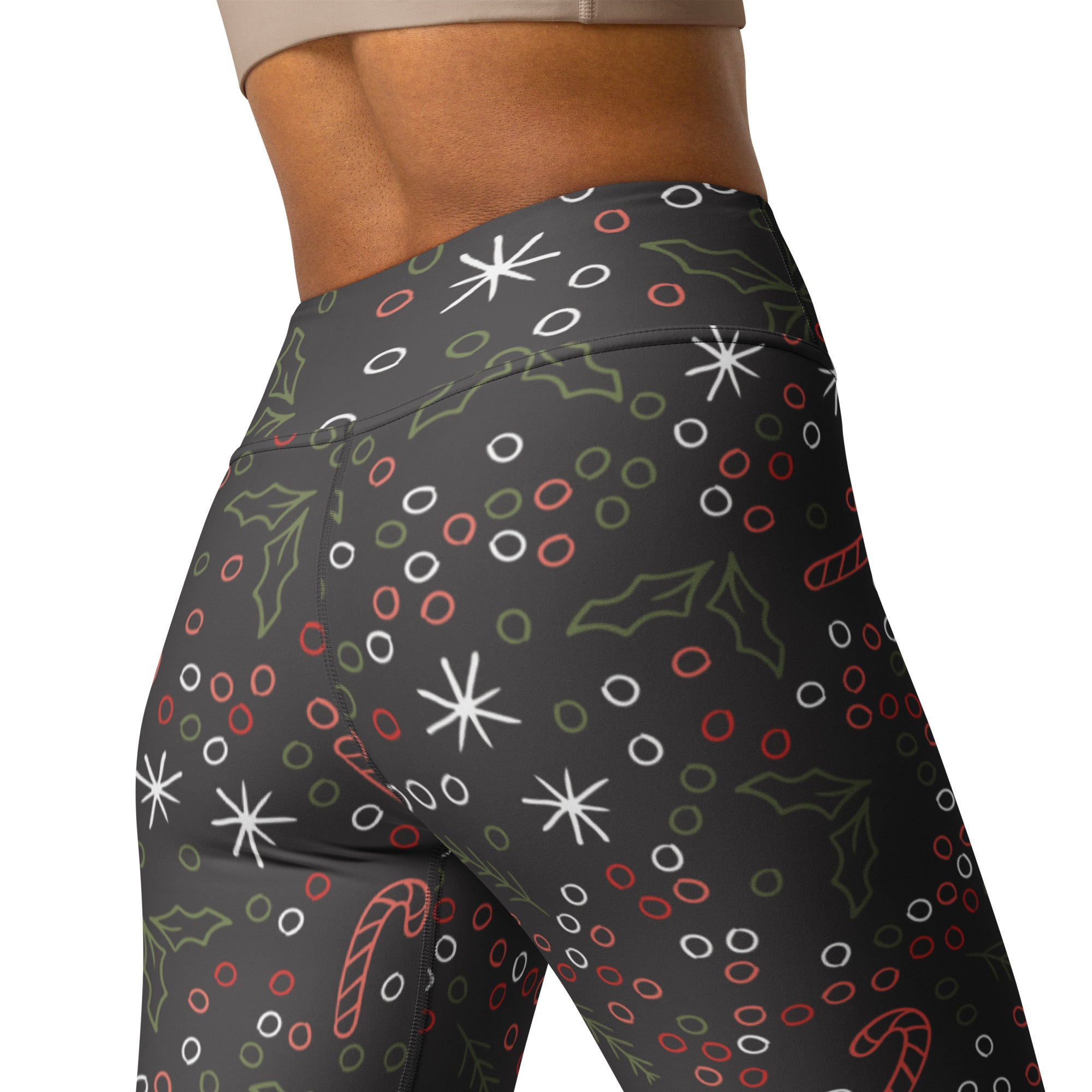 Women’s dark gray buttery soft high-waisted yoga leggings with festive holiday stars candy canes and holly print