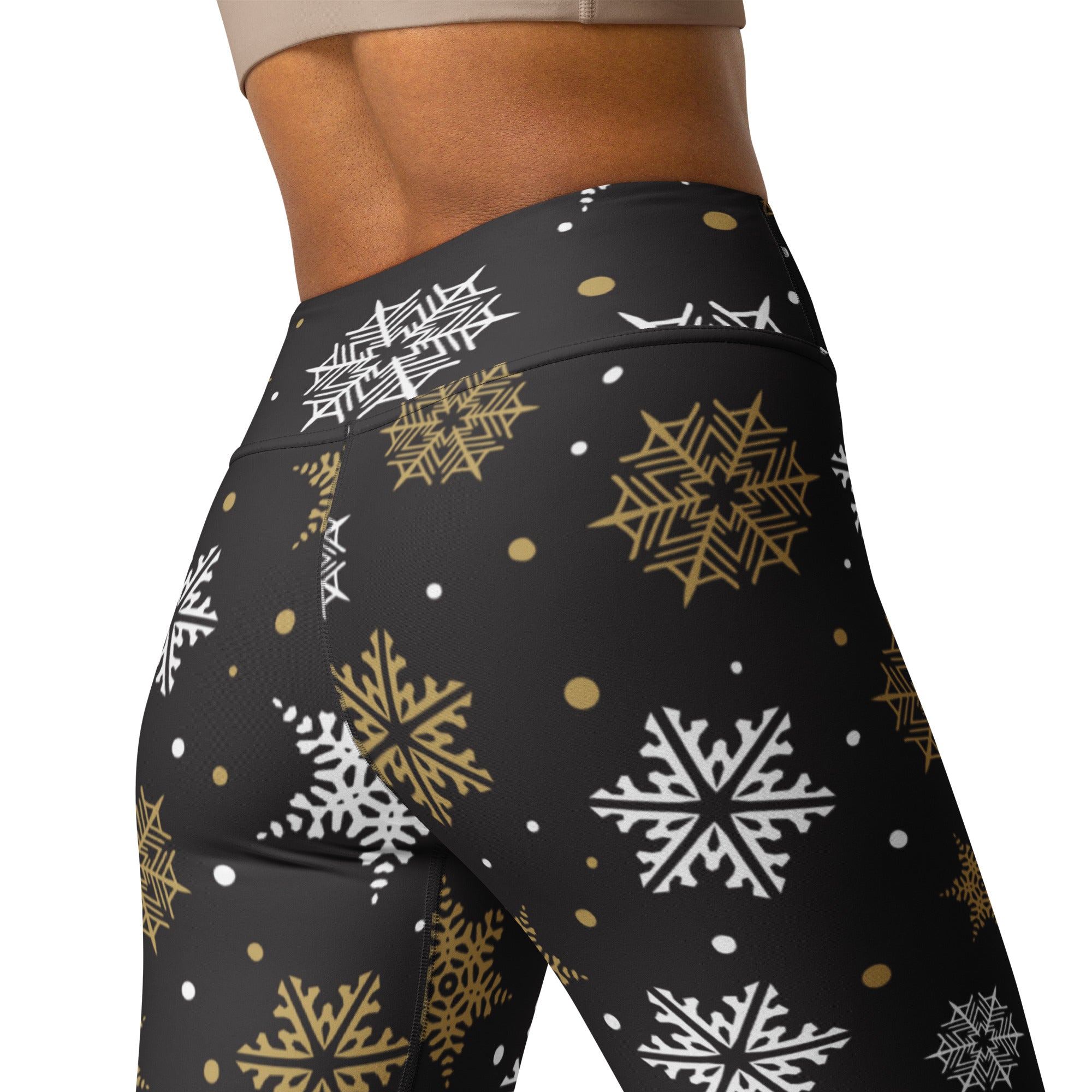 Women’s black high-waisted buttery soft yoga leggings with white and gold snowflake festive pattern