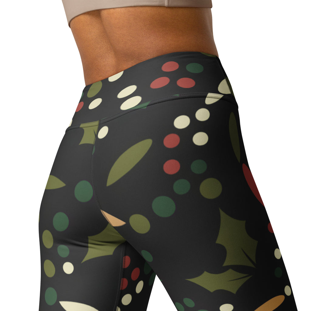 Black high waisted buttery soft yoga leggings with red green cream polka dots and olive green holly leaves pattern
