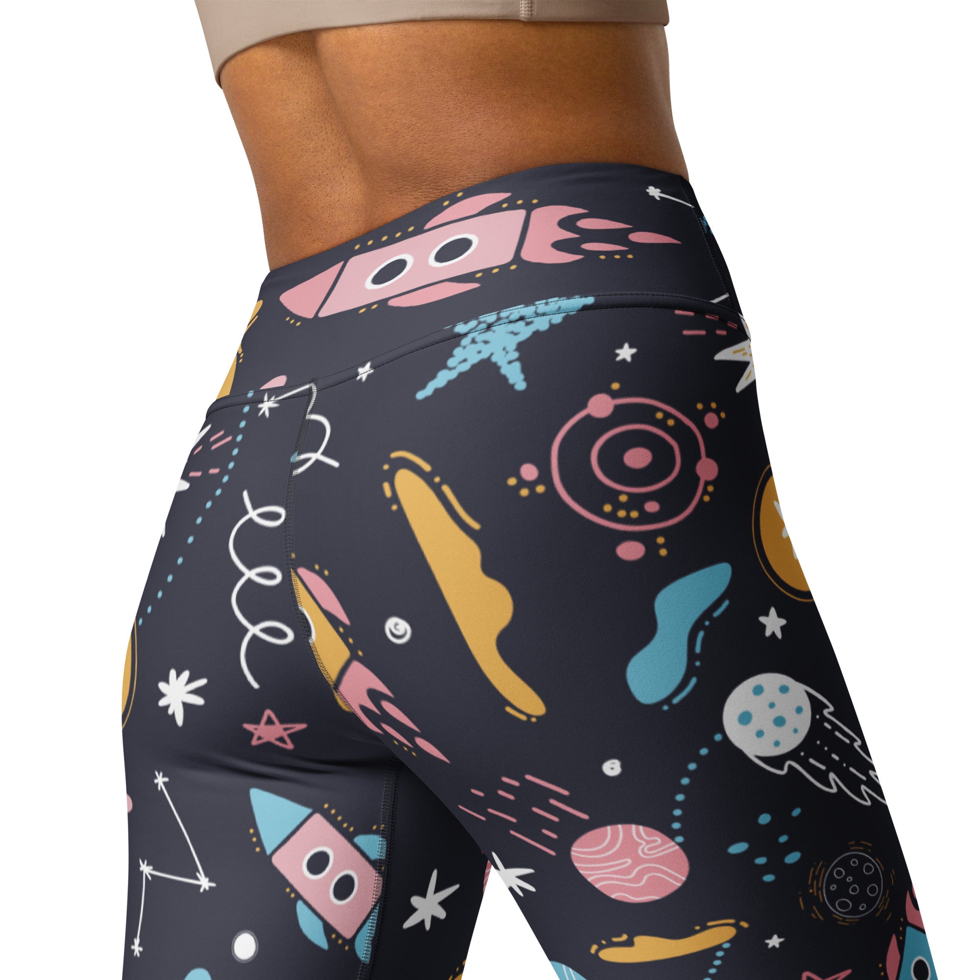 Women’s outer space buttery soft yoga leggings in dark navy with colorful cartoon rockets planets and stars print