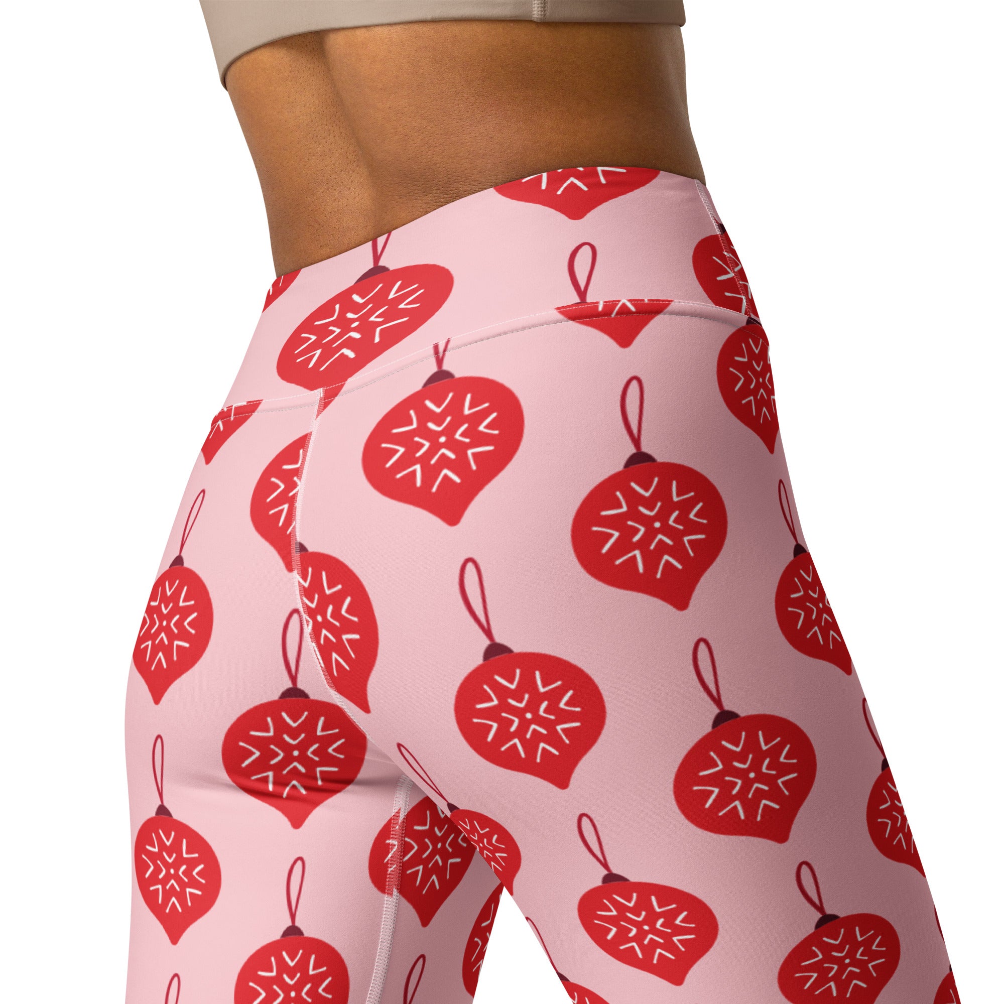 Women’s pink high-waisted buttery soft yoga leggings with red christmas ornament pattern and white snowflakes
