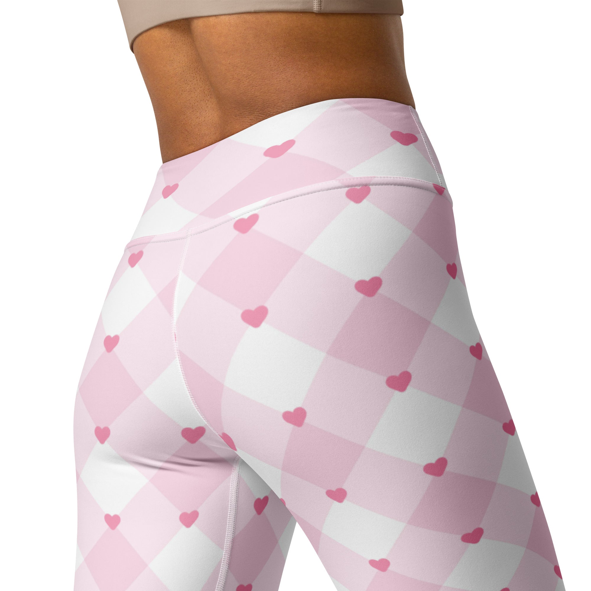 Women’s pink and white argyle patterned buttery soft high waisted yoga leggings with small pink heart motifs