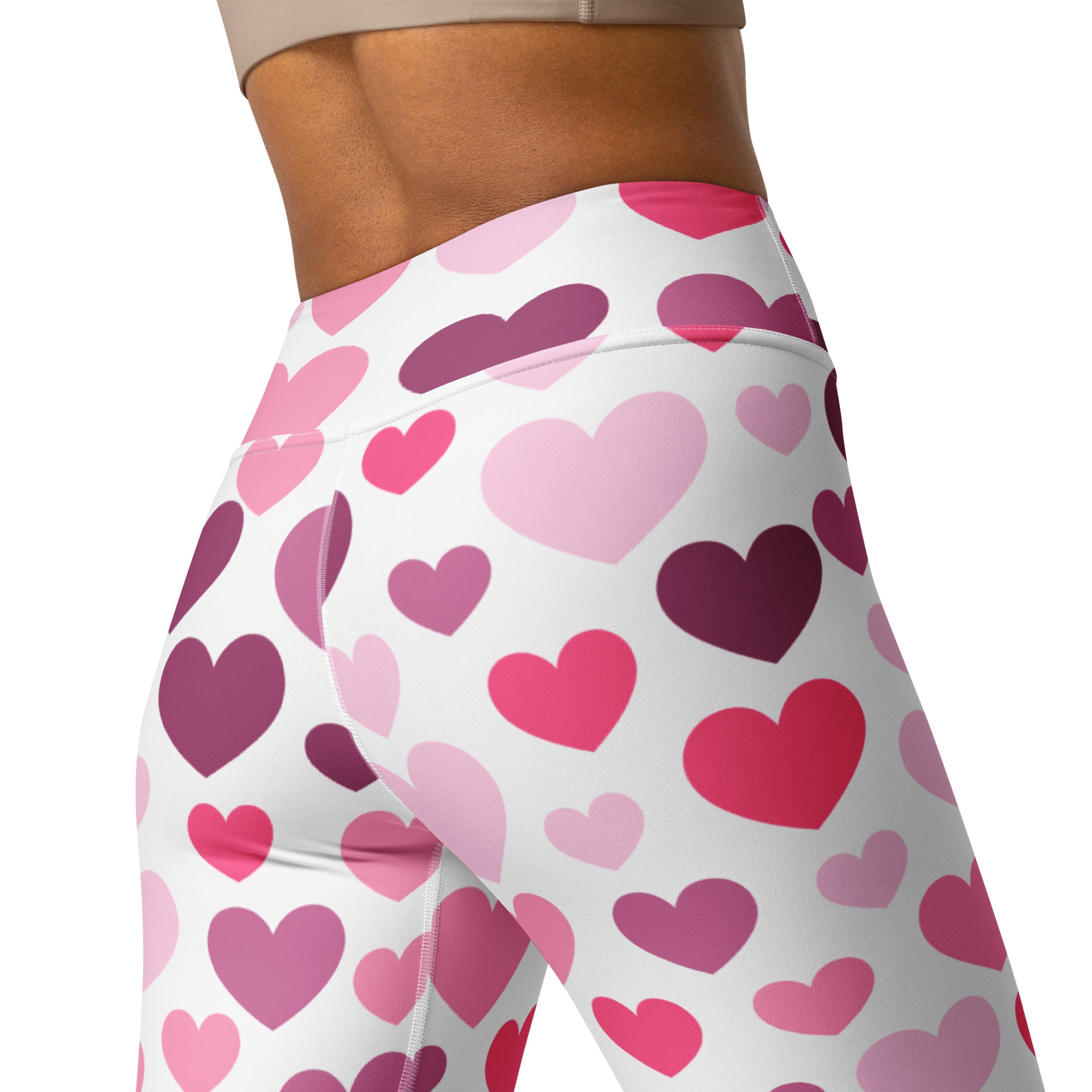White high-waisted yoga leggings with vibrant pink and purple hearts quick drying buttery soft comfort