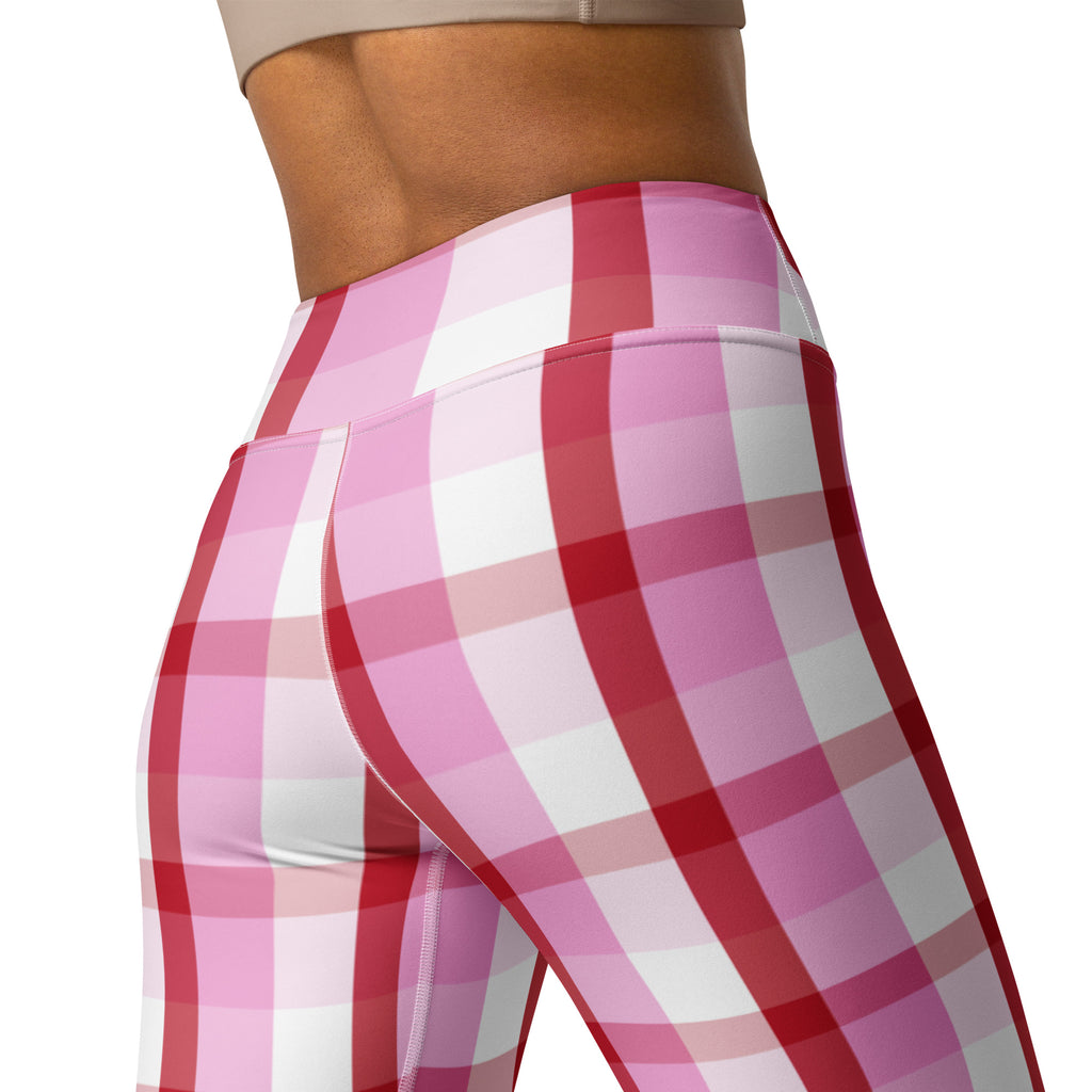 High waisted women’s yoga leggings in vibrant pink and white plaid with red accents made from buttery soft quick drying fabric
