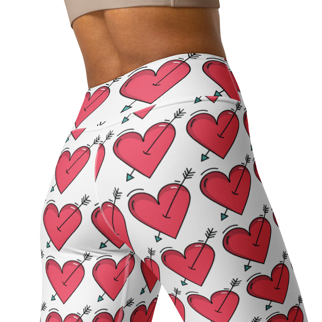 Women’s white high waisted buttery soft yoga leggings with vibrant red hearts and black arrow pattern quick drying