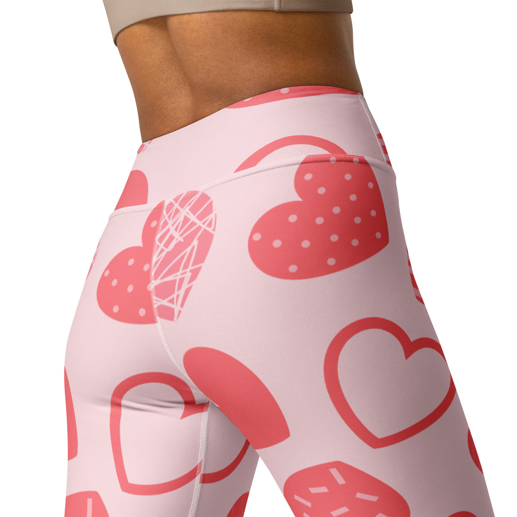 Women’s pink heart pattern high waisted yoga leggings with buttery soft fabric and strawberry themed designs