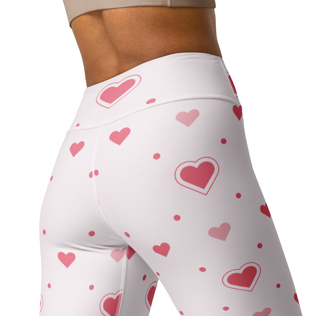 White high-waisted buttery soft yoga leggings with playful pink heart and dot pattern, quick drying and comfortable