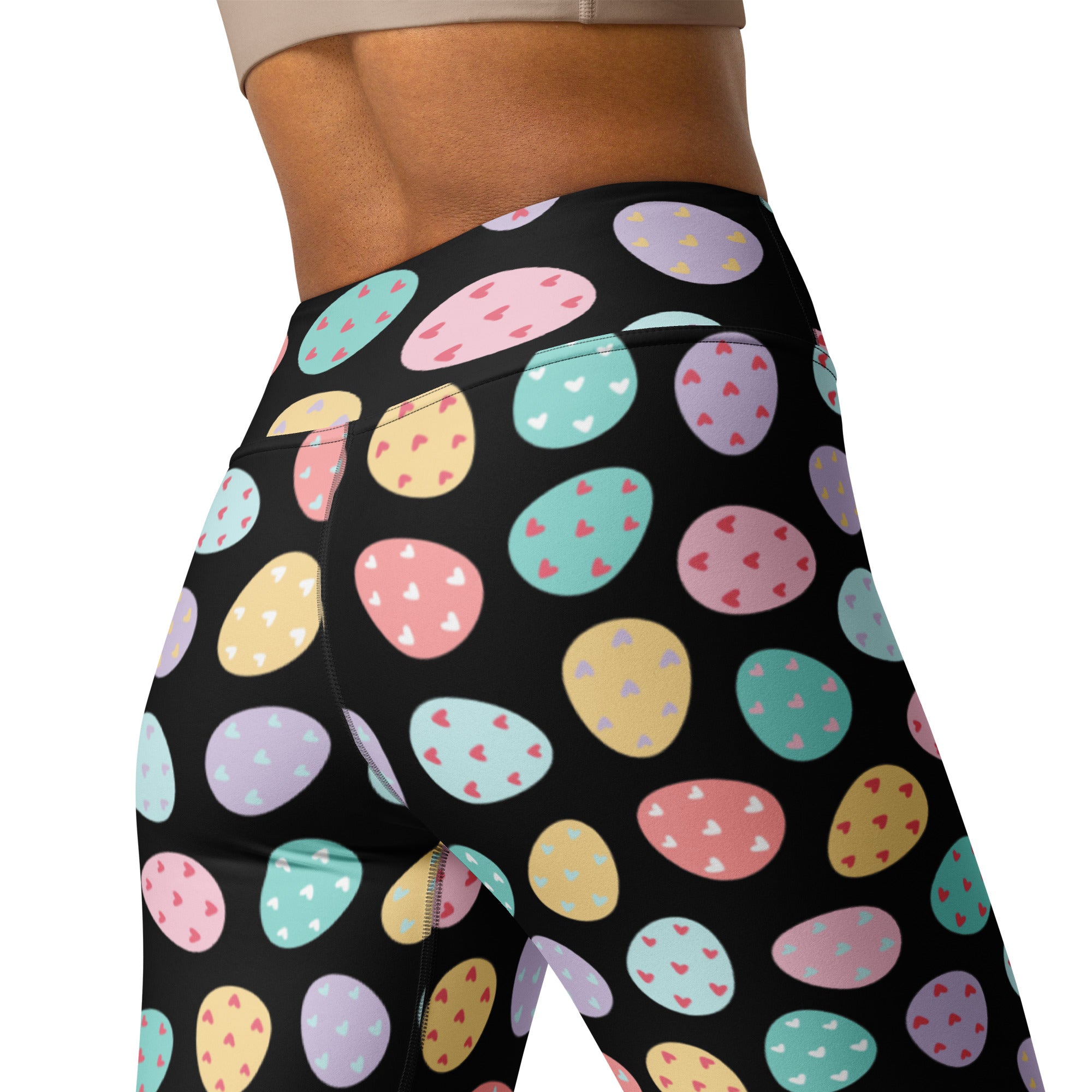Black high waisted buttery soft yoga leggings with pastel colorful Easter eggs and tiny heart details designed for quick drying