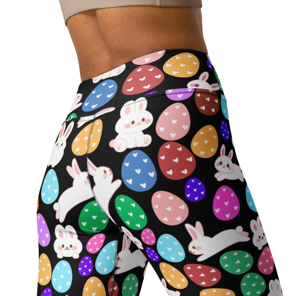 Black high waisted buttery soft yoga leggings with colorful easter eggs and white cartoon bunnies with hearts