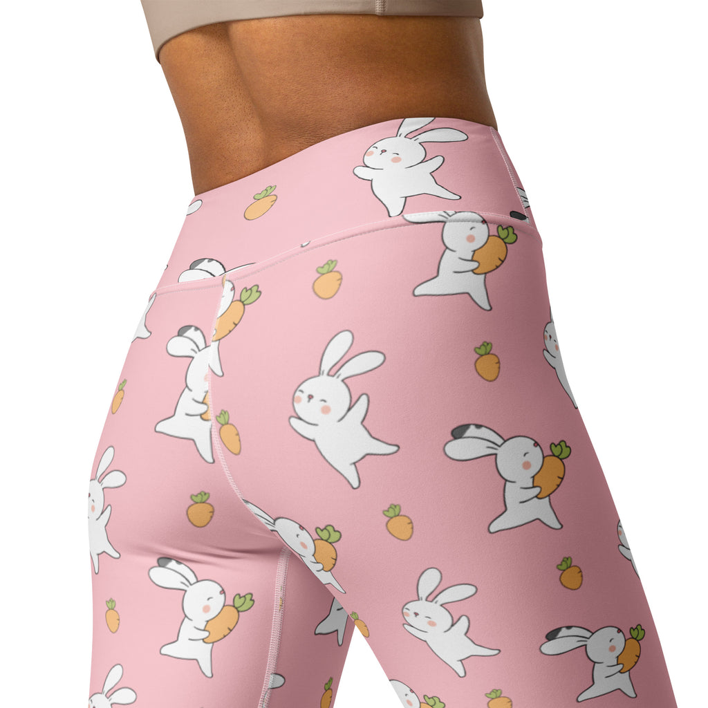 Women’s pink high waisted buttery soft yoga leggings with white cartoon bunnies holding carrots quick drying