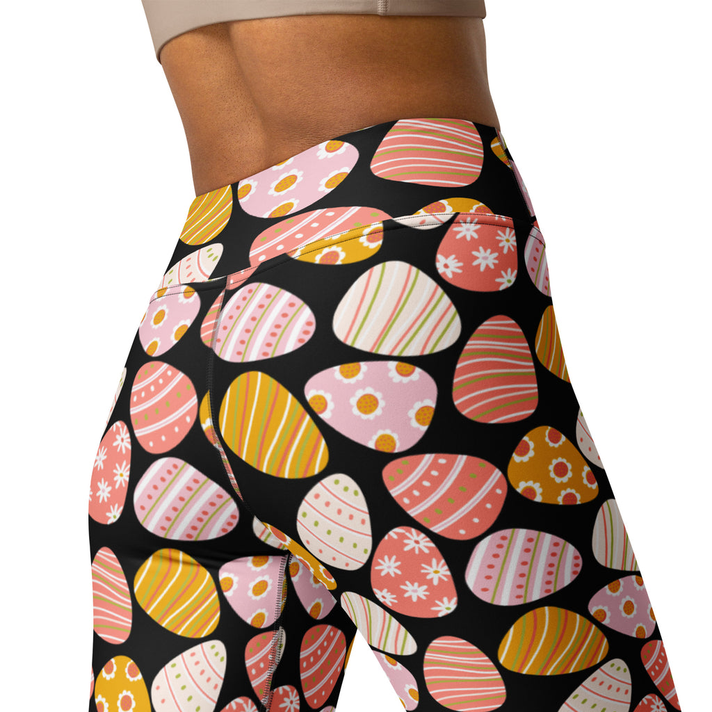 Women’s coral easter egg buttery soft black high waisted yoga leggings with vibrant pink yellow and orange patterns