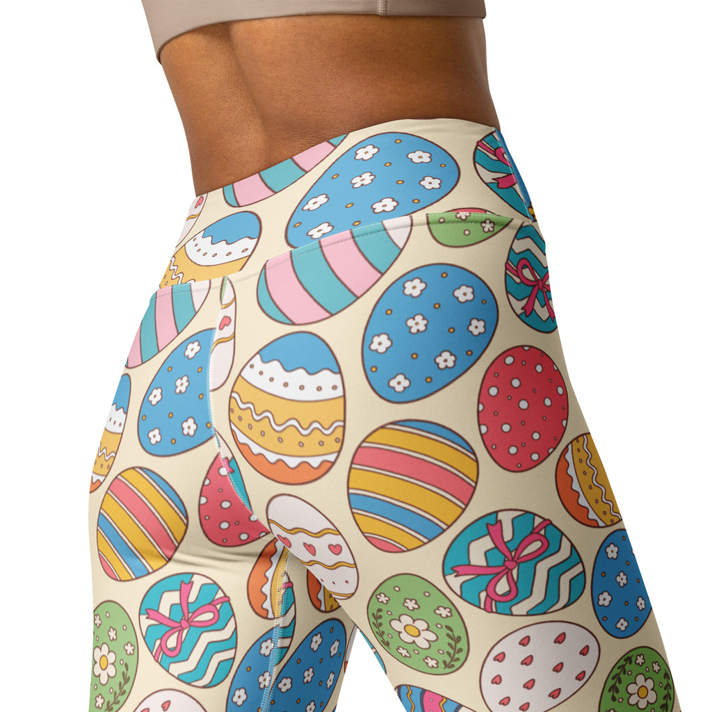 Cream-colored buttery soft women’s yoga leggings with colorful cartoon Easter egg print in blue pink yellow and green