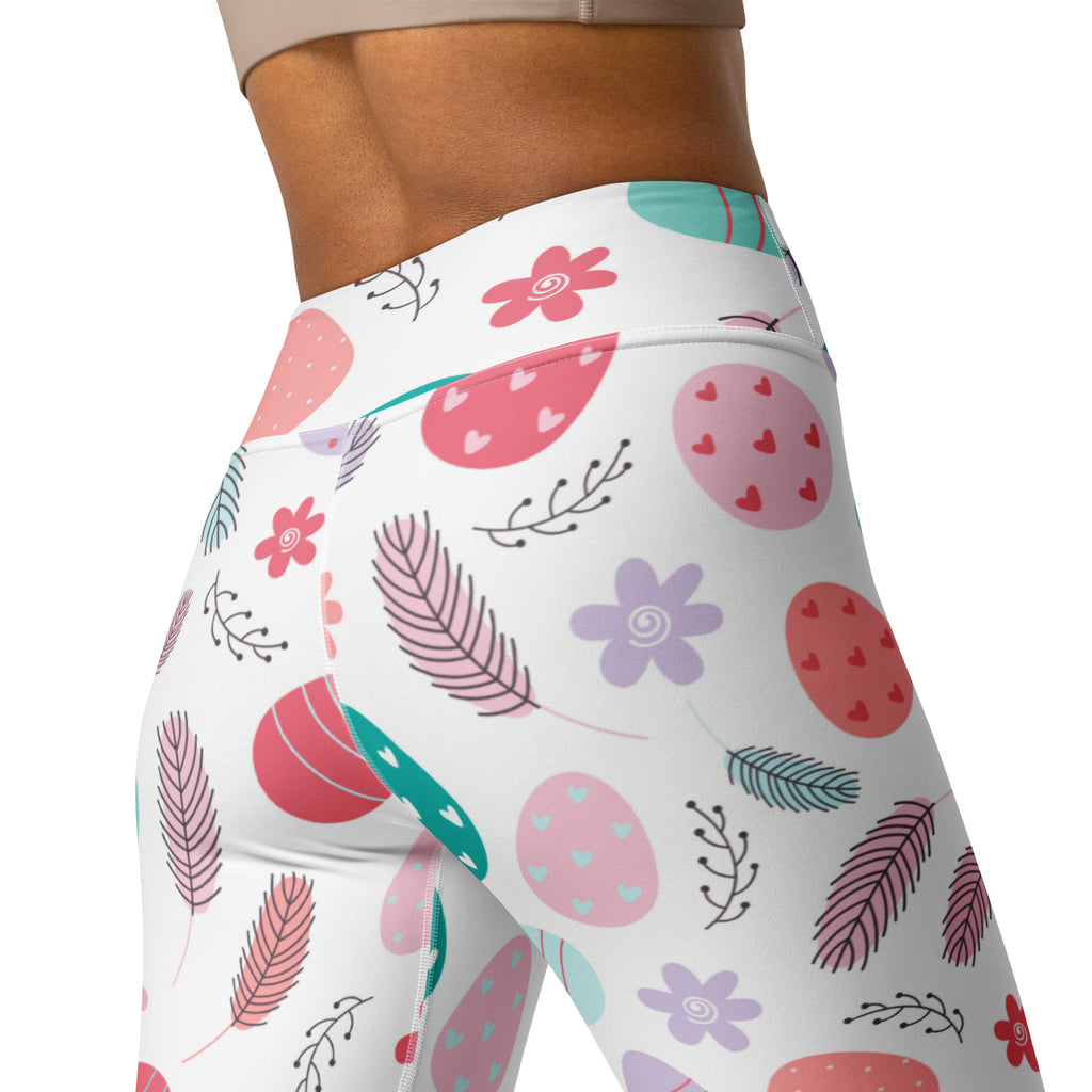 White high waisted buttery soft yoga leggings with pastel pink purple teal easter eggs hearts feathers and flowers pattern