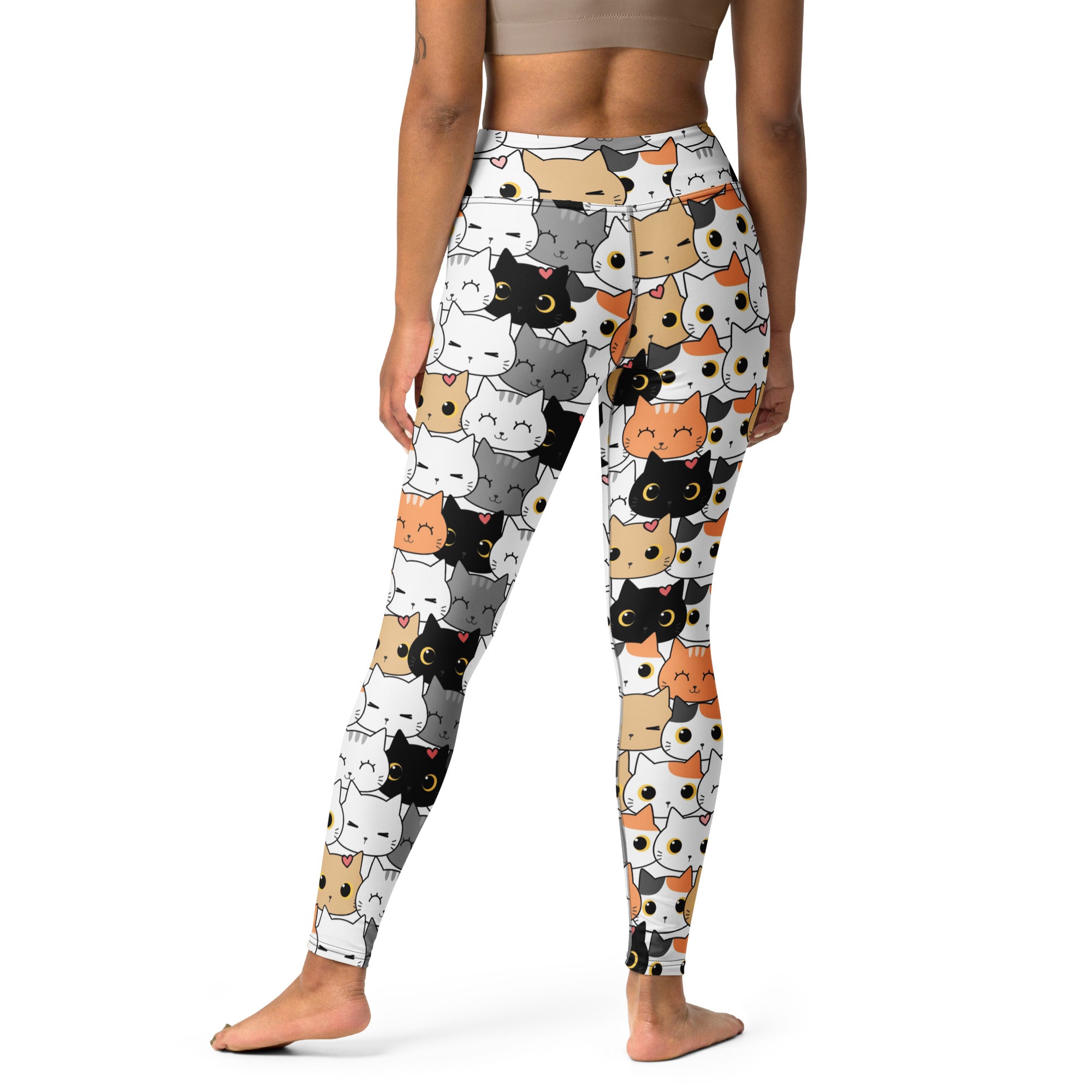 White buttery soft women’s yoga leggings with playful multicolor cartoon cat face pattern