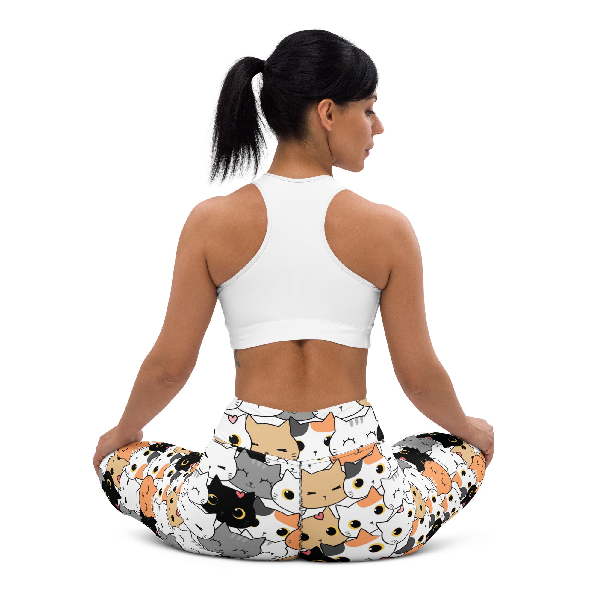 Women’s buttery soft yoga leggings in white with multicolored cat face patterns for comfortable activewear