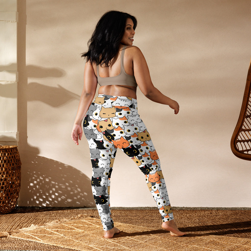 White women’s buttery soft yoga leggings with playful colorful cartoon cat face pattern on front side
