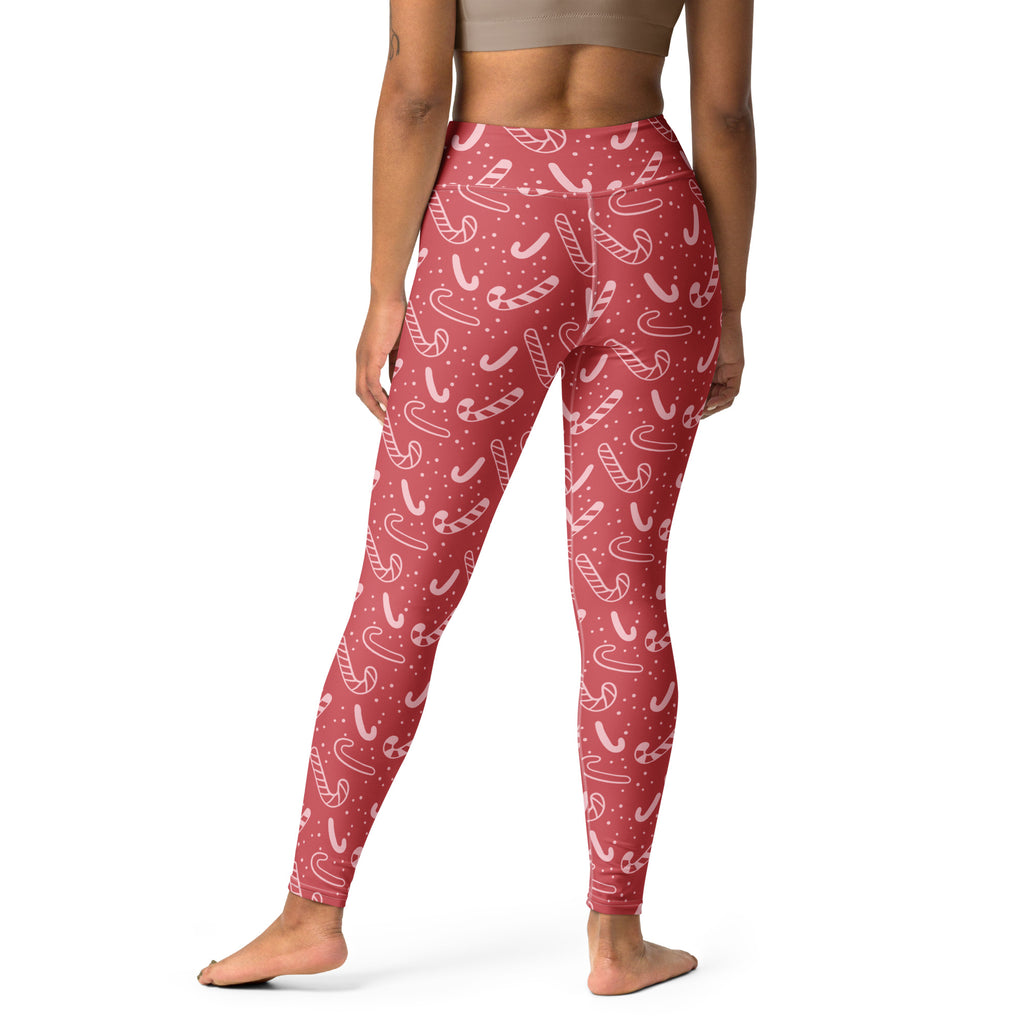 Women’s red buttery soft yoga leggings with white candy cane and dot pattern for christmas festive wear