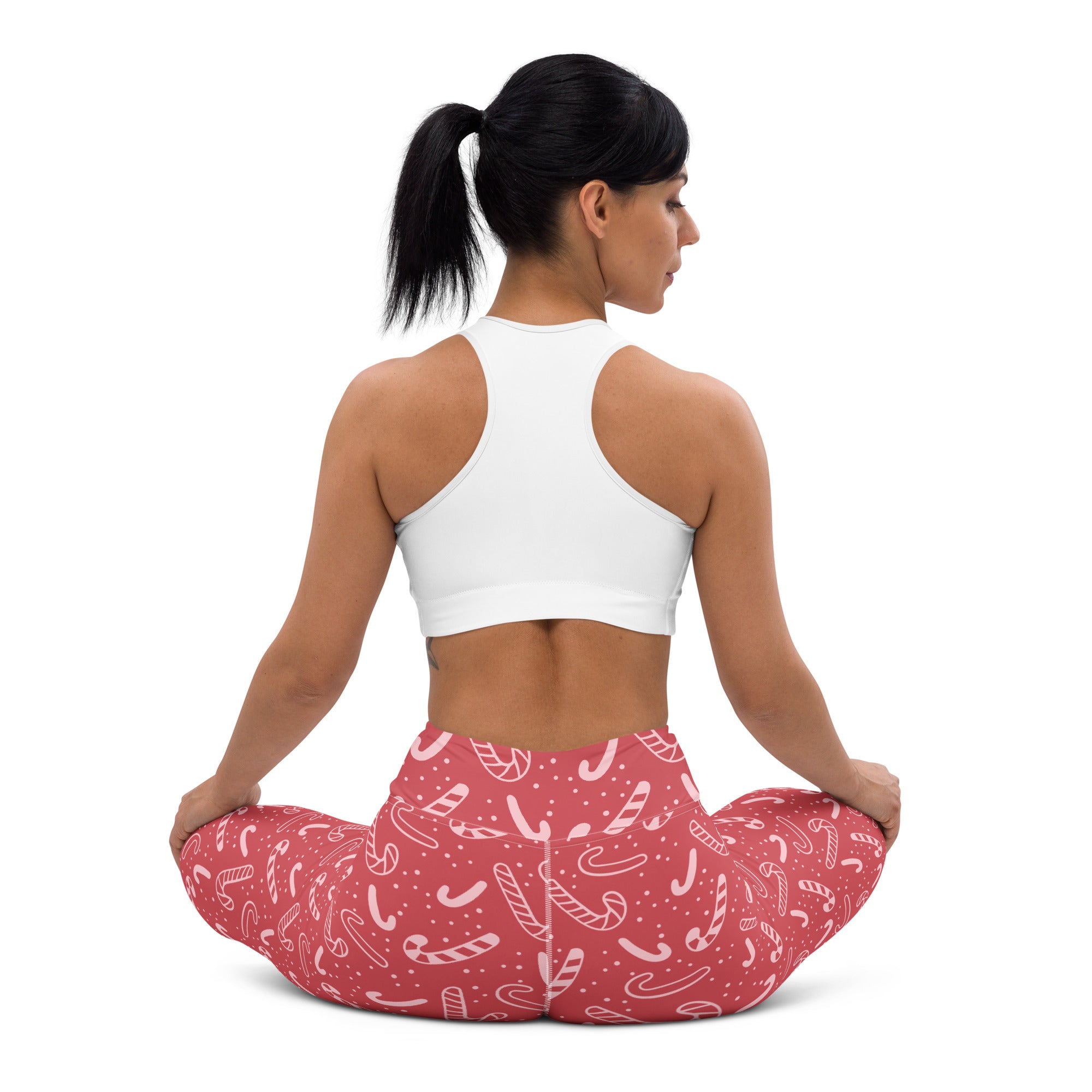 Women’s red buttery soft yoga leggings with white candy cane pattern perfect for christmas workouts