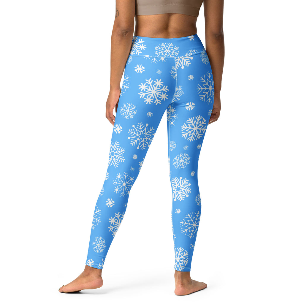 Women’s blue high-waisted snowflake buttery soft yoga leggings with a cozy winter pattern
