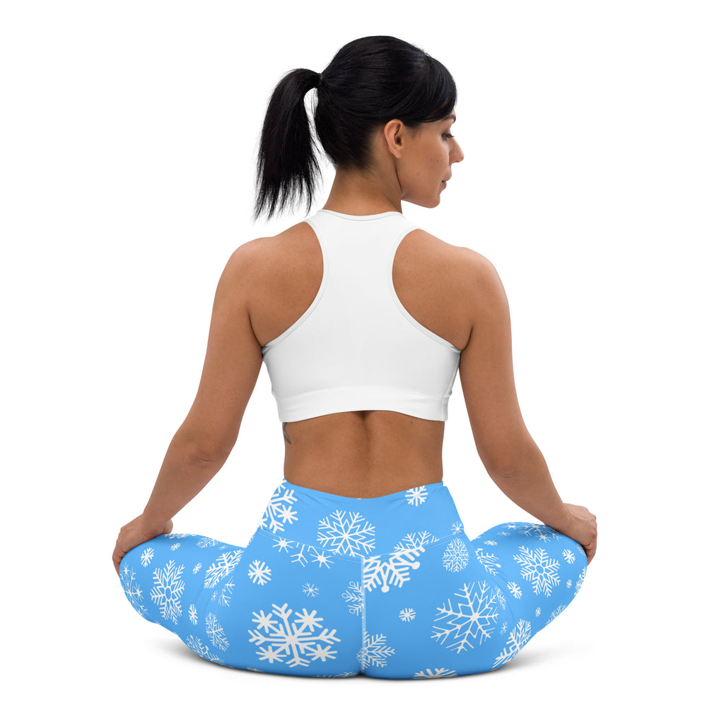 Blue buttery soft women’s yoga leggings with white snowflake pattern perfect for winter workouts