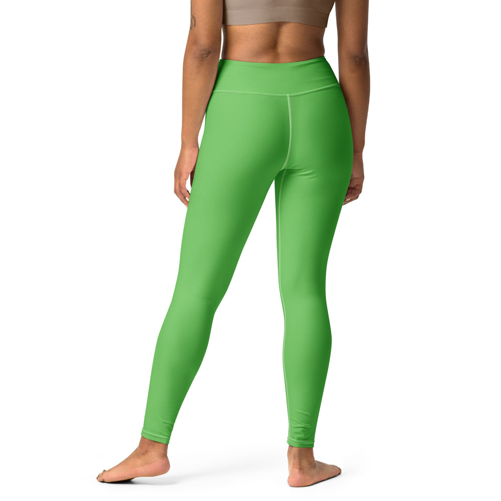 Bright green high waisted buttery soft yoga leggings made of stretchy form fitting fabric for women