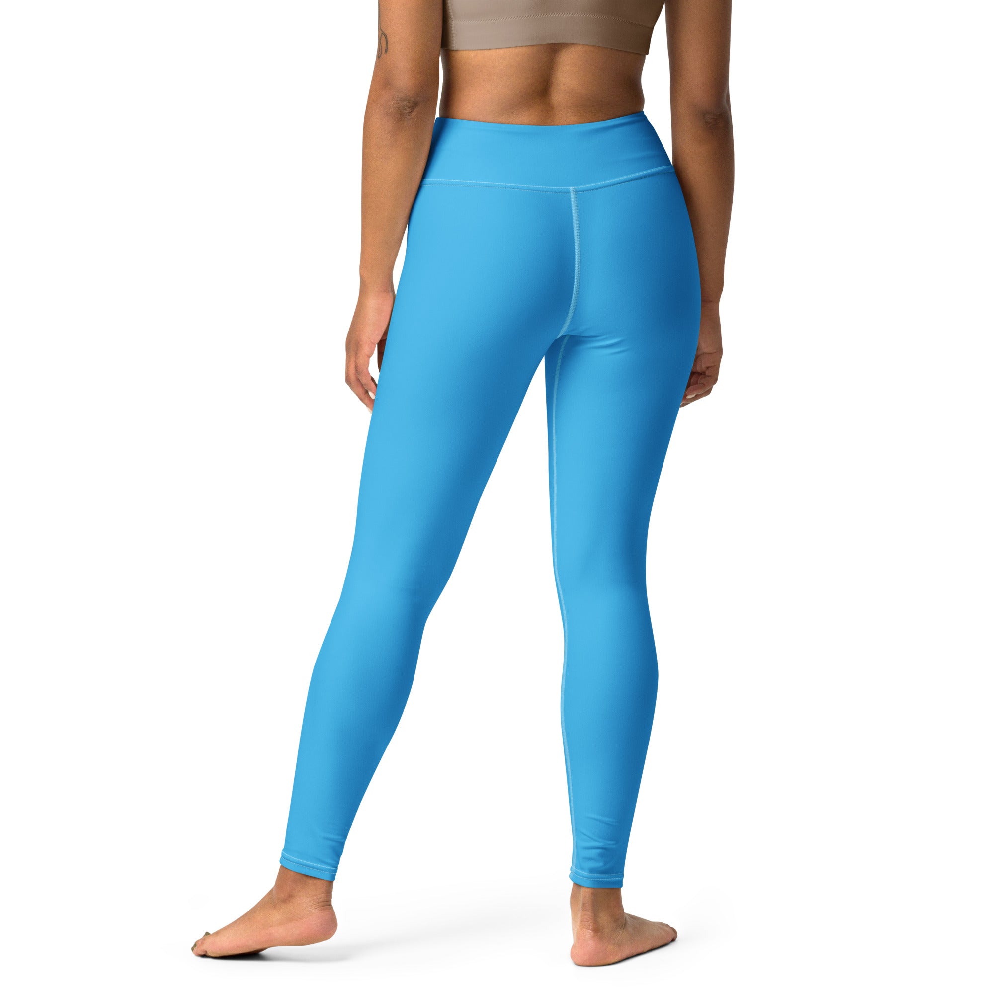 Bright blue high-waisted women’s yoga leggings made of stretchy buttery soft fabric for a comfortable fit