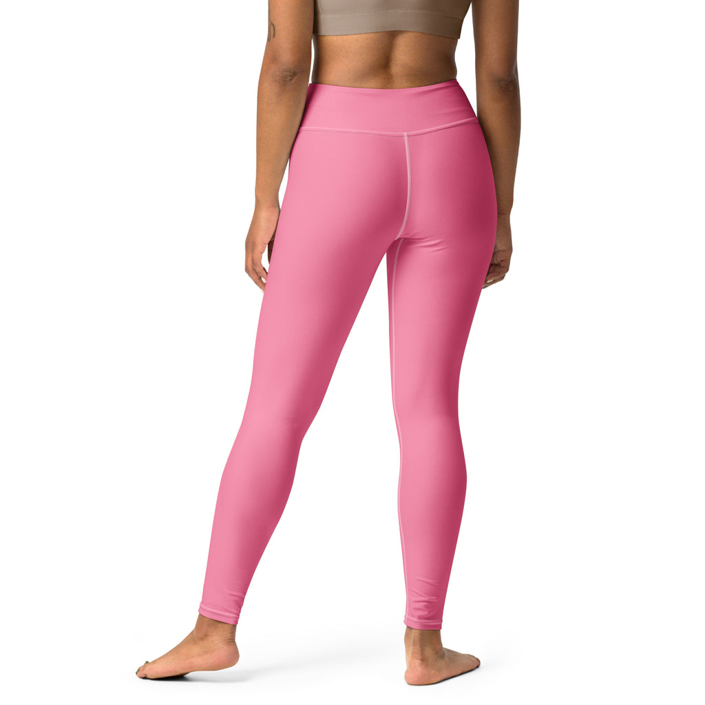 Women’s pink buttery soft yoga leggings made of stretchy form-fitting fabric shown from the back side