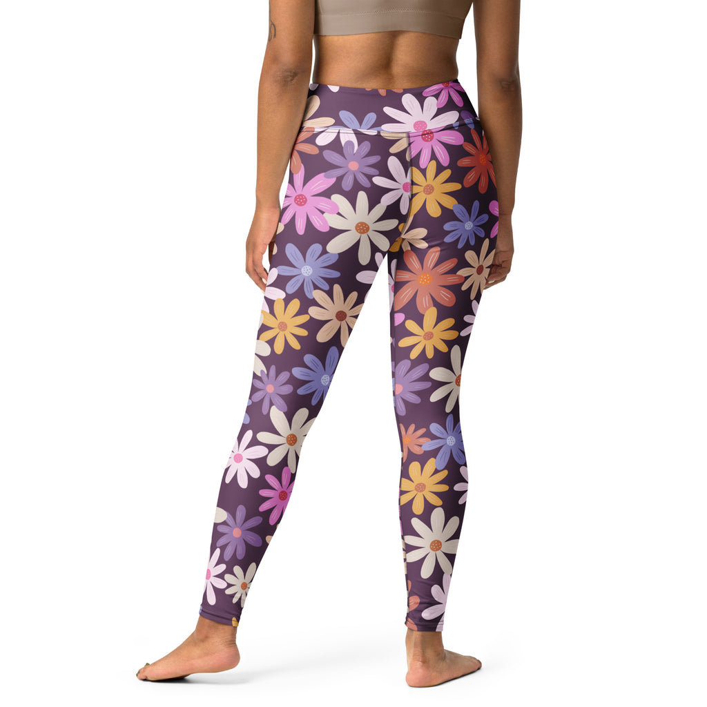 Women purple high-waisted buttery soft yoga leggings with vibrant floral daisies in pink yellow blue and white