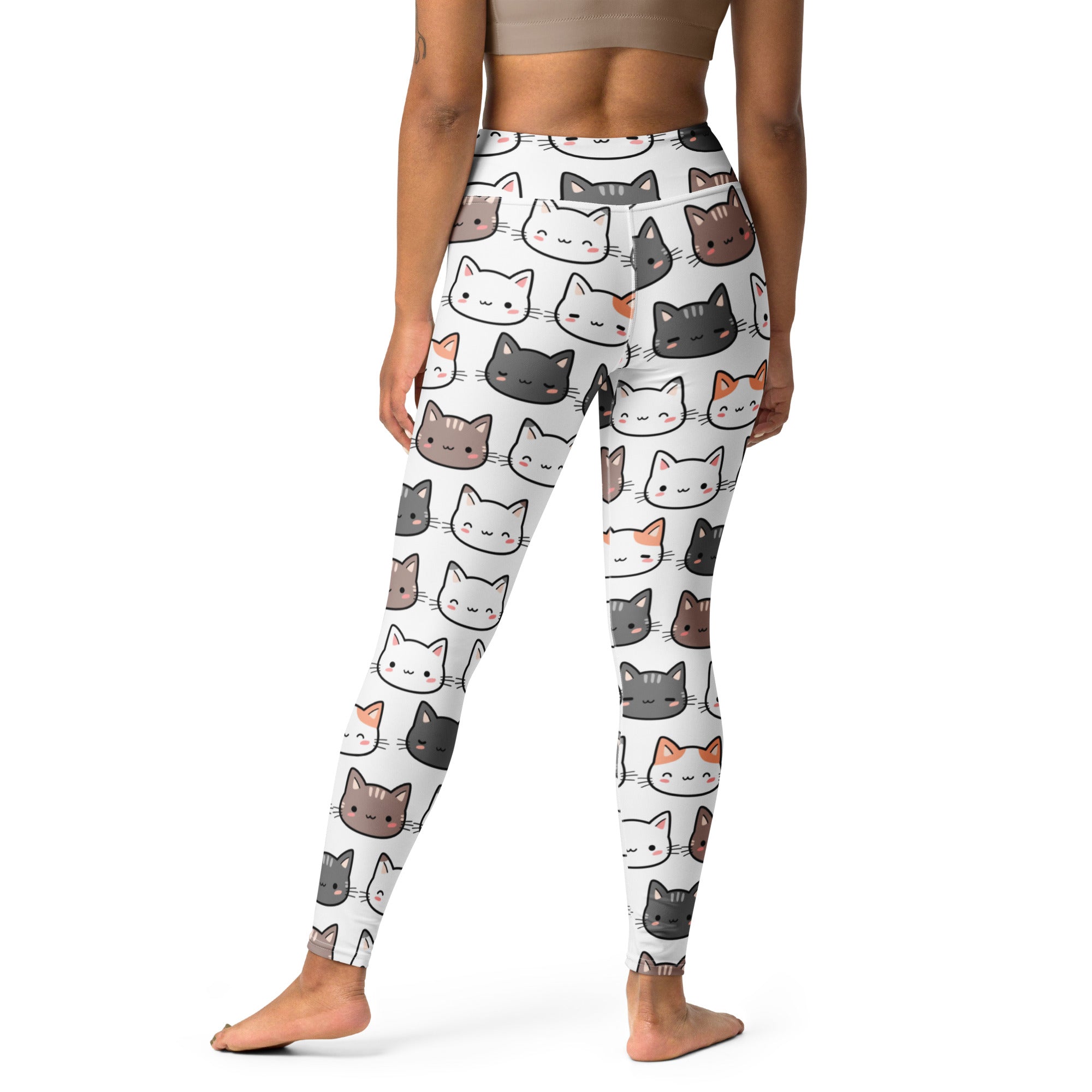 White women’s buttery soft yoga leggings with playful cartoon cats in black gray white and orange pattern