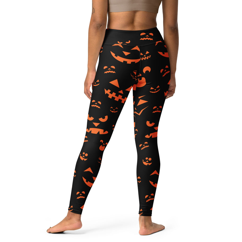 Women’s black buttery soft yoga leggings with vibrant orange jack-o’-lantern faces for halloween