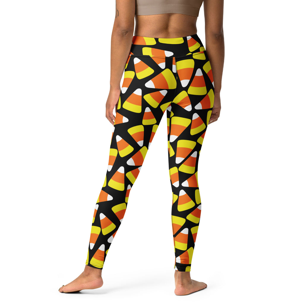 Women’s buttery soft black yoga leggings with vibrant orange yellow and white candy corn pattern for halloween