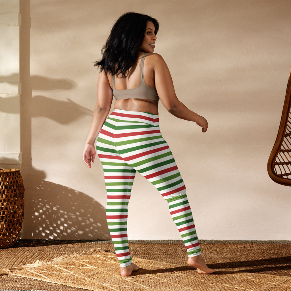 Women’s striped Christmas buttery soft yoga leggings in red and green stripes with white accents made of stretchy fabric