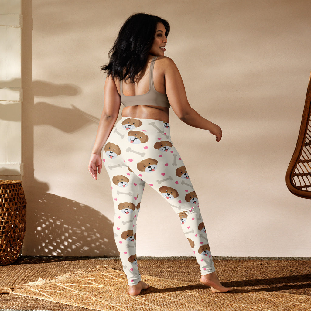 White women’s buttery soft yoga leggings with brown puppy faces pink hearts and bone patterns playful design