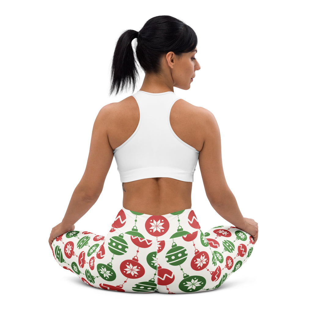 White leggings featuring a festive pattern of red and green christmas ornaments and snowflakes on a buttery soft fabric