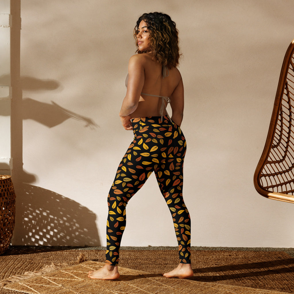 Women’s gold leaves buttery soft yoga leggings in black with a vibrant yellow orange and brown leaf pattern