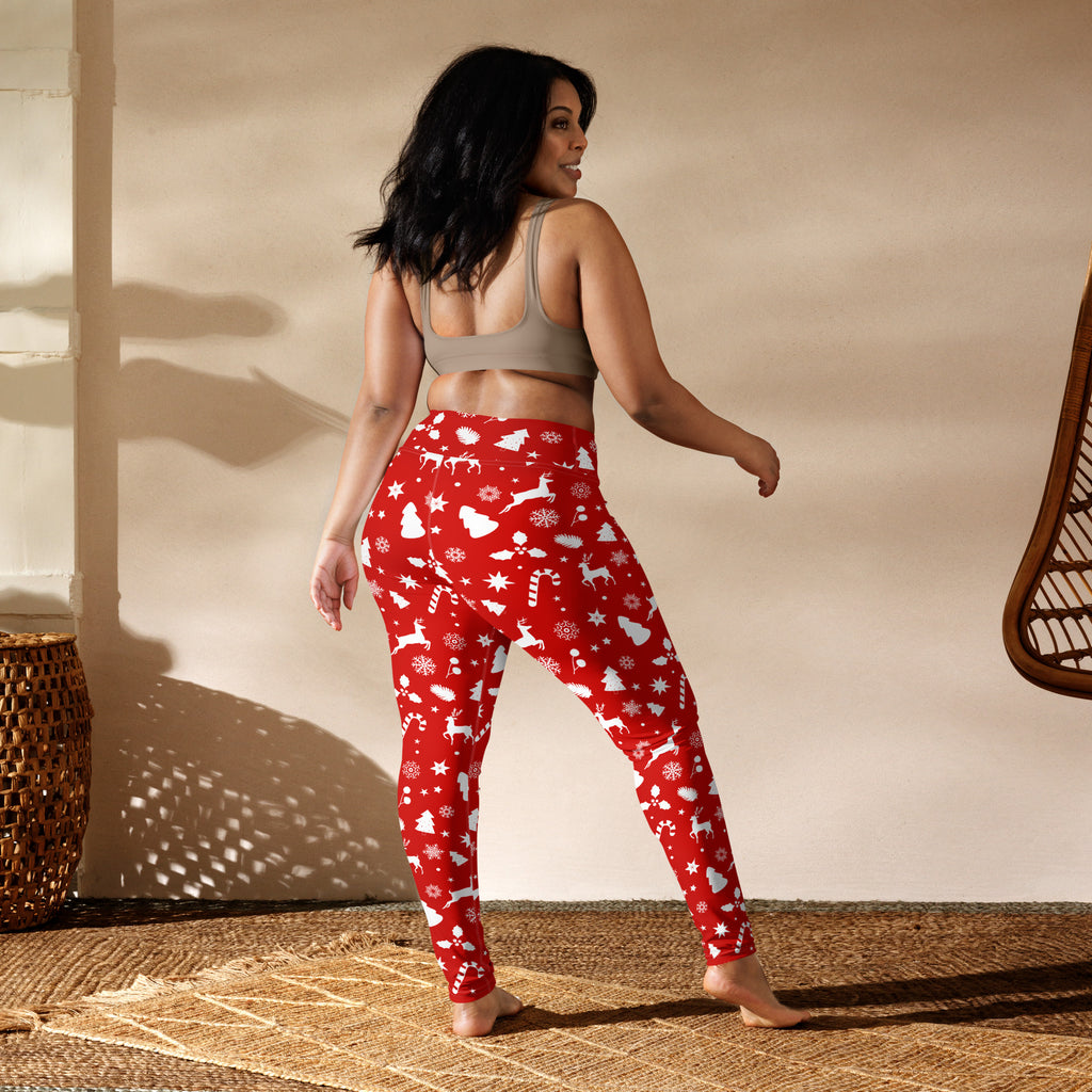 Women’s red christmas buttery soft yoga leggings with white reindeer snowflakes and candy cane patterns