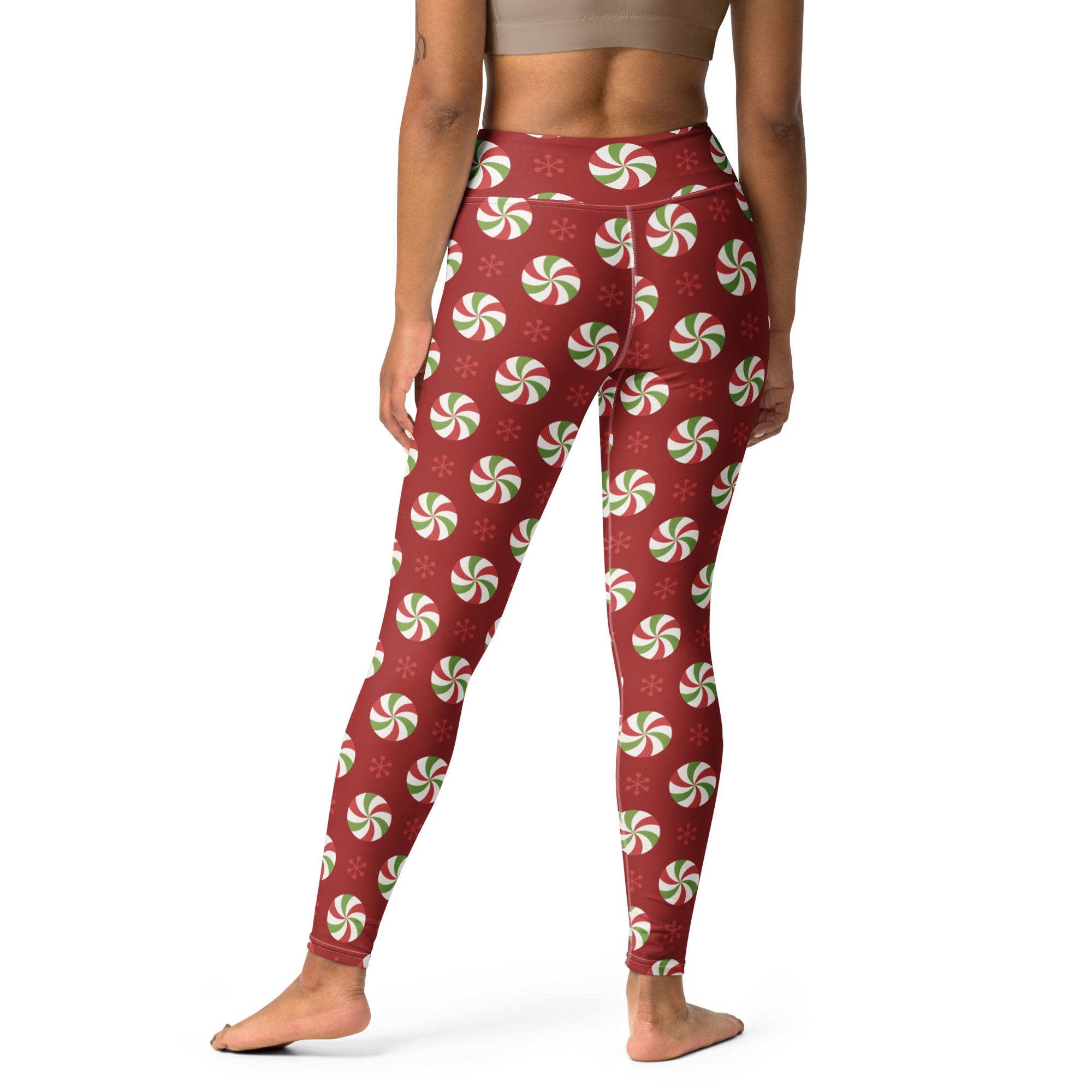 Women’s buttery soft red yoga leggings with festive green and white peppermint candy pattern for Christmas use