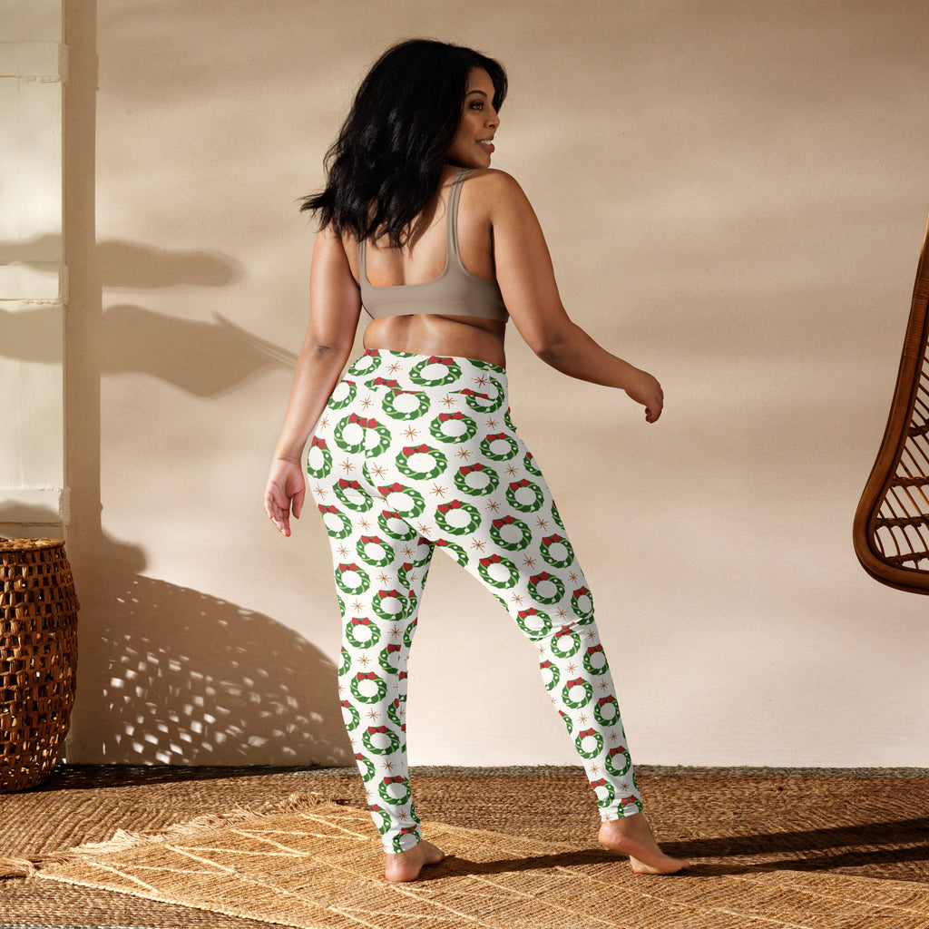 Women’s buttery soft white yoga leggings with green wreaths red bows and star accents christmas pattern