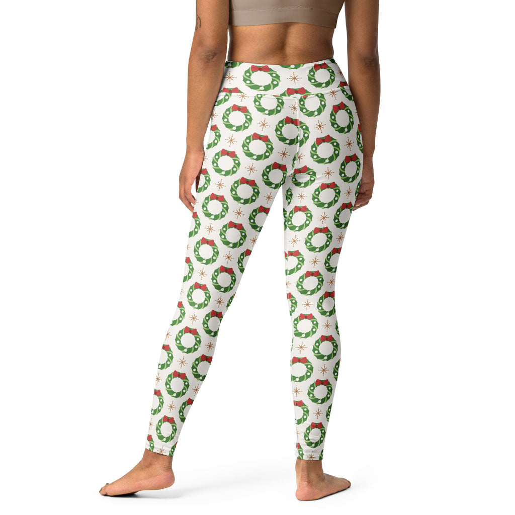 Women’s Christmas wreath buttery soft white yoga leggings with green wreaths red bows and starburst accents pattern