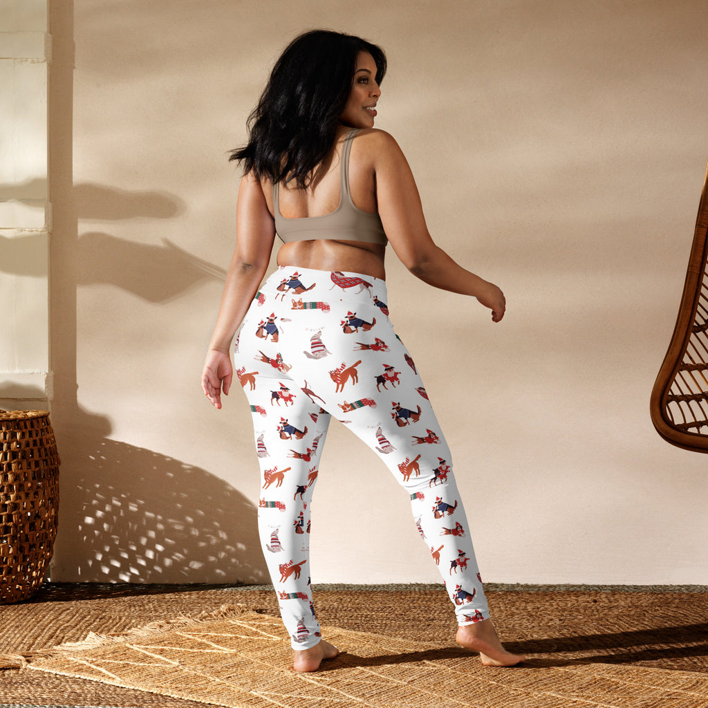 White women’s buttery soft yoga leggings with red and blue festive foxes wearing hats and scarves
