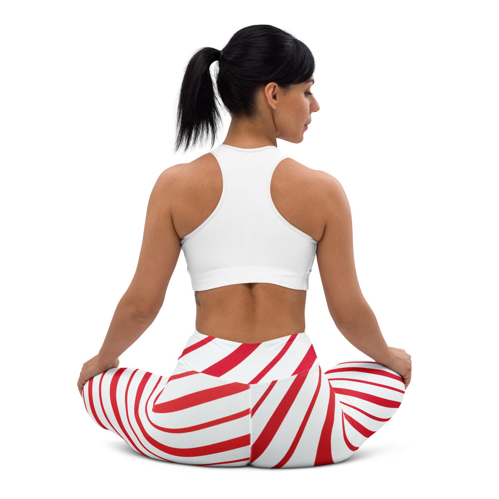 Women’s buttery soft yoga leggings with red and white swirling candy cane stripe pattern