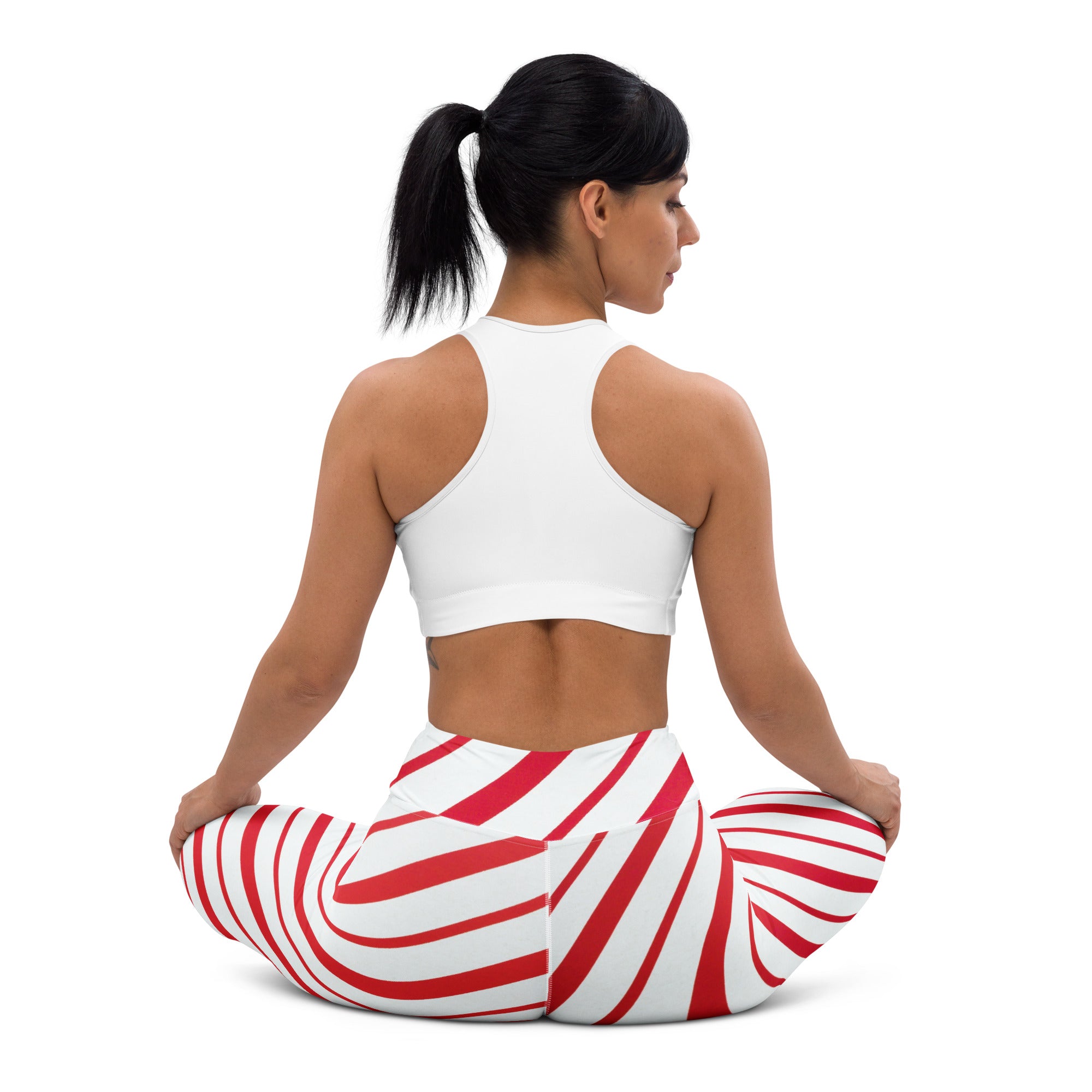 Women’s buttery soft yoga leggings with red and white swirling candy cane stripe pattern
