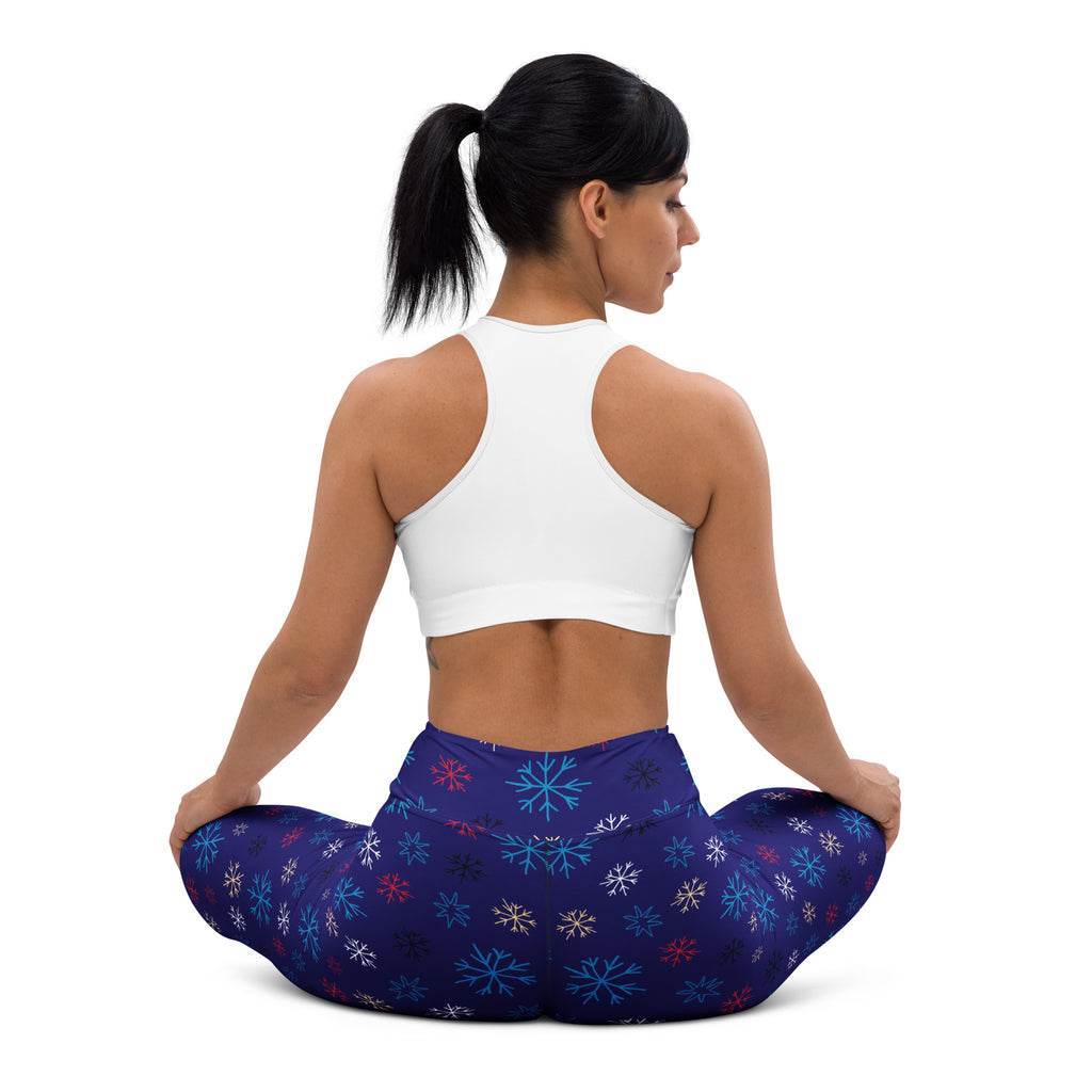 Women’s navy snowflake buttery soft yoga leggings with dark blue fabric and vibrant teal red and white snowflake pattern