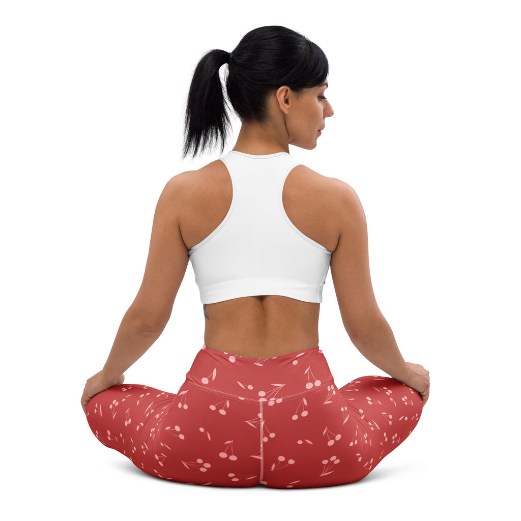 Women’s red cherry print high-waisted buttery soft yoga leggings designed for comfort and style during workouts