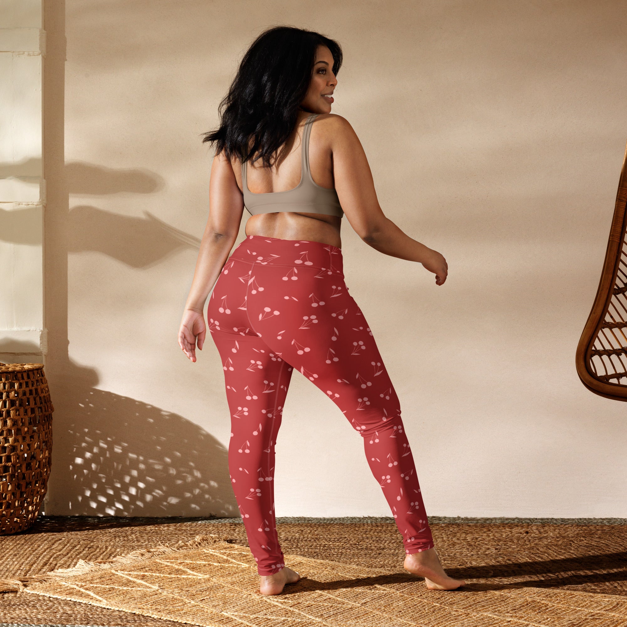 Women’s red cherry print high-waisted buttery soft leggings suitable for yoga and active wear