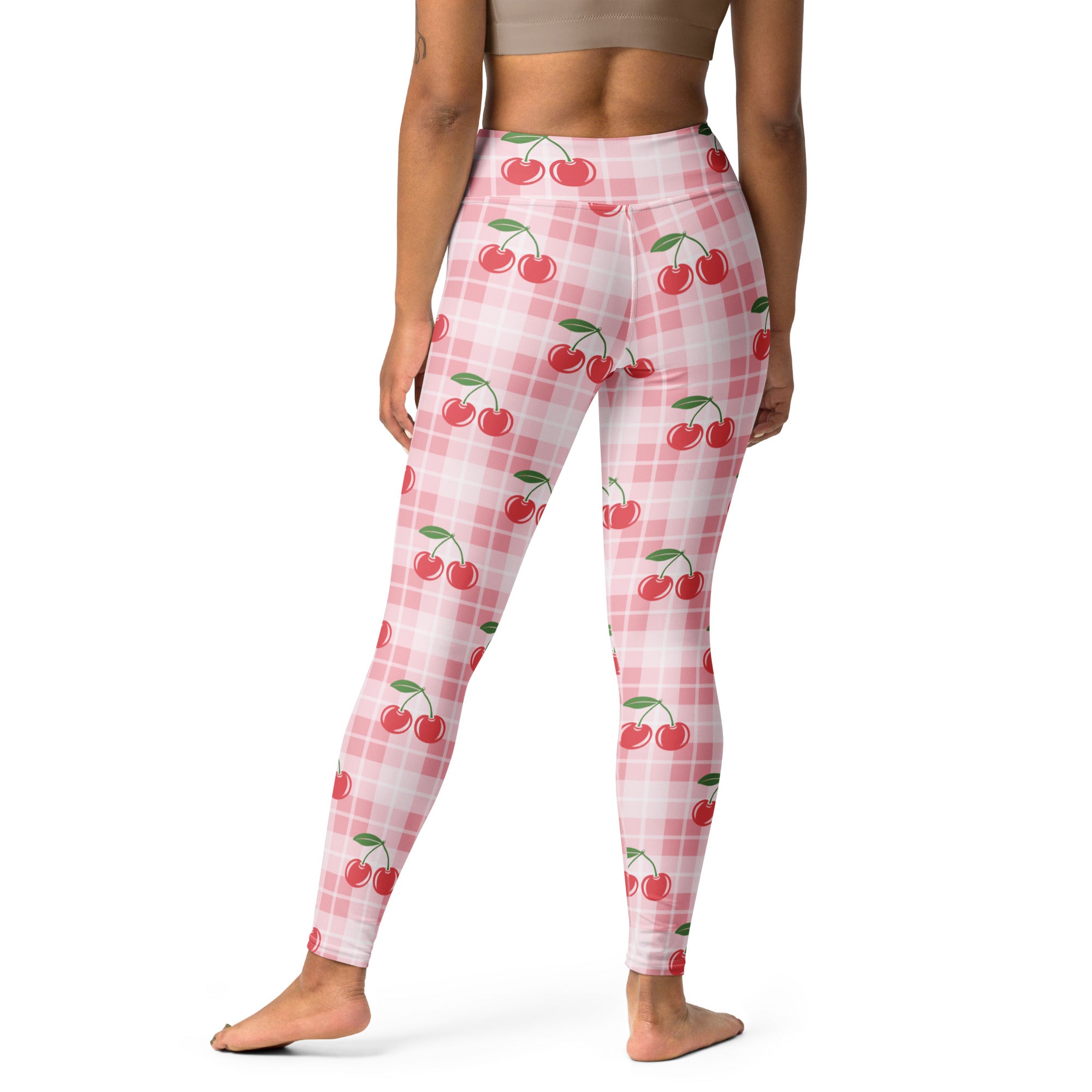 Women’s pink gingham cherry buttery soft yoga leggings with red cherry pattern and green stems on pink and white plaid