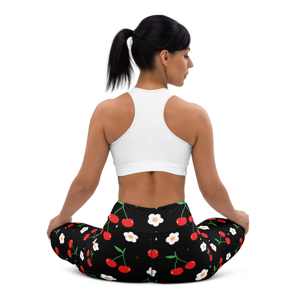 Women’s black cherry blossom buttery soft yoga leggings with playful red cherry and white daisy pattern
