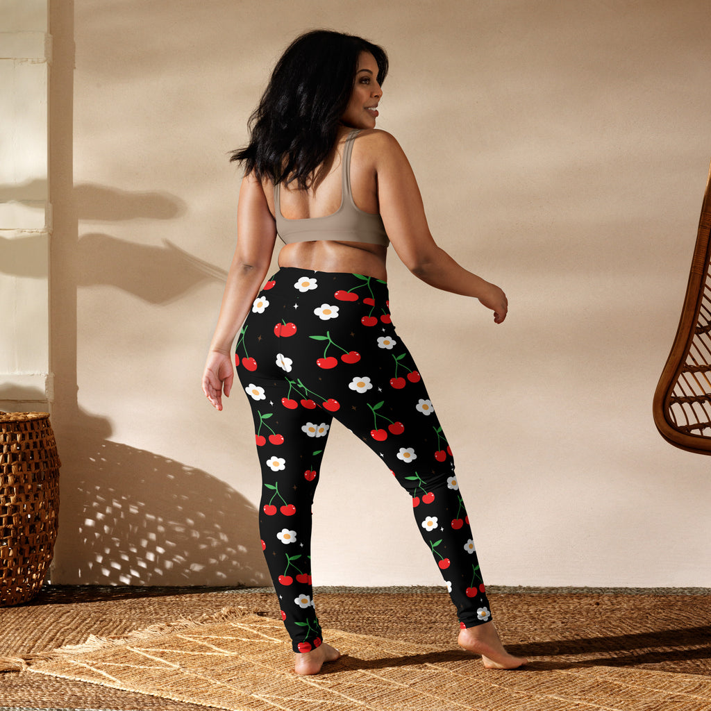 Women’s black butter soft yoga leggings with vibrant red cherry and white flower pattern