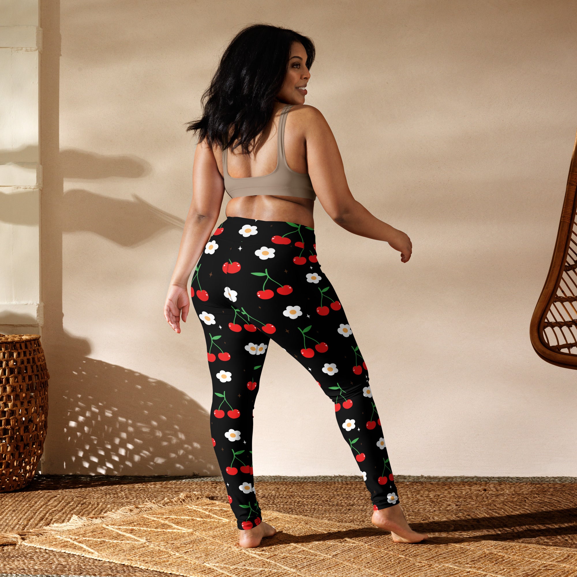 Women’s black butter soft yoga leggings with vibrant red cherry and white flower pattern