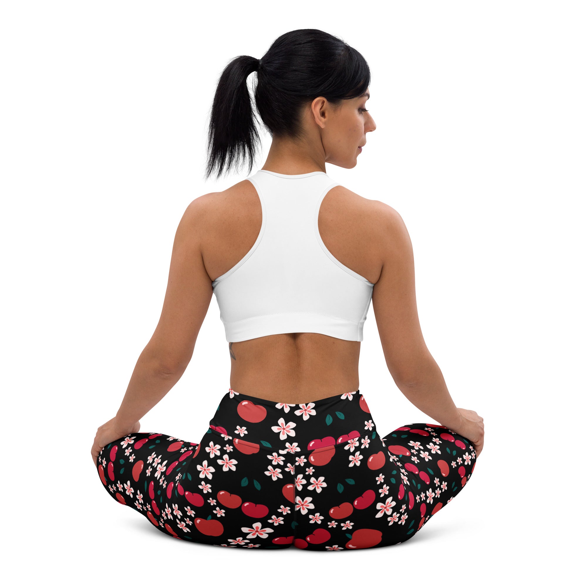 Women’s black buttery soft yoga leggings with vibrant red cherry and pink flower pattern for apple blossom look